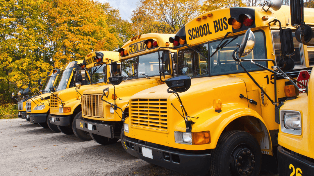 School event transportation bus in Massachusetts with students boarding safely during a field trip