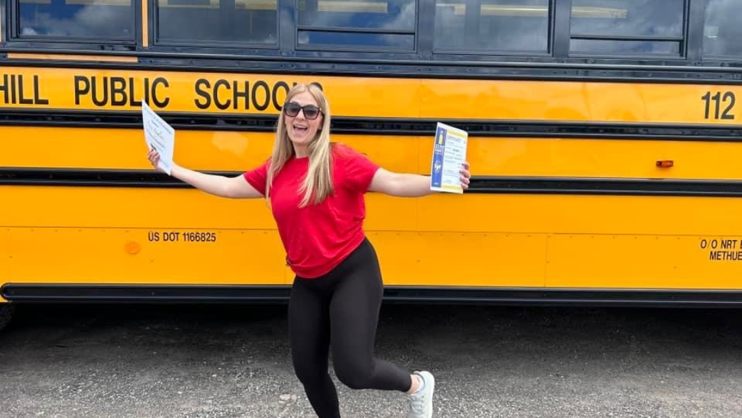 Yellow school bus in Massachusetts with GPS map overlay, representing bus route optimization tools for safer and more efficient student transportation